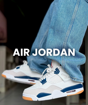 Air Jordan sneakers worn by model in white and blue