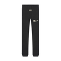 Fear of God Essentials 1977 sweatpants in iron black front view