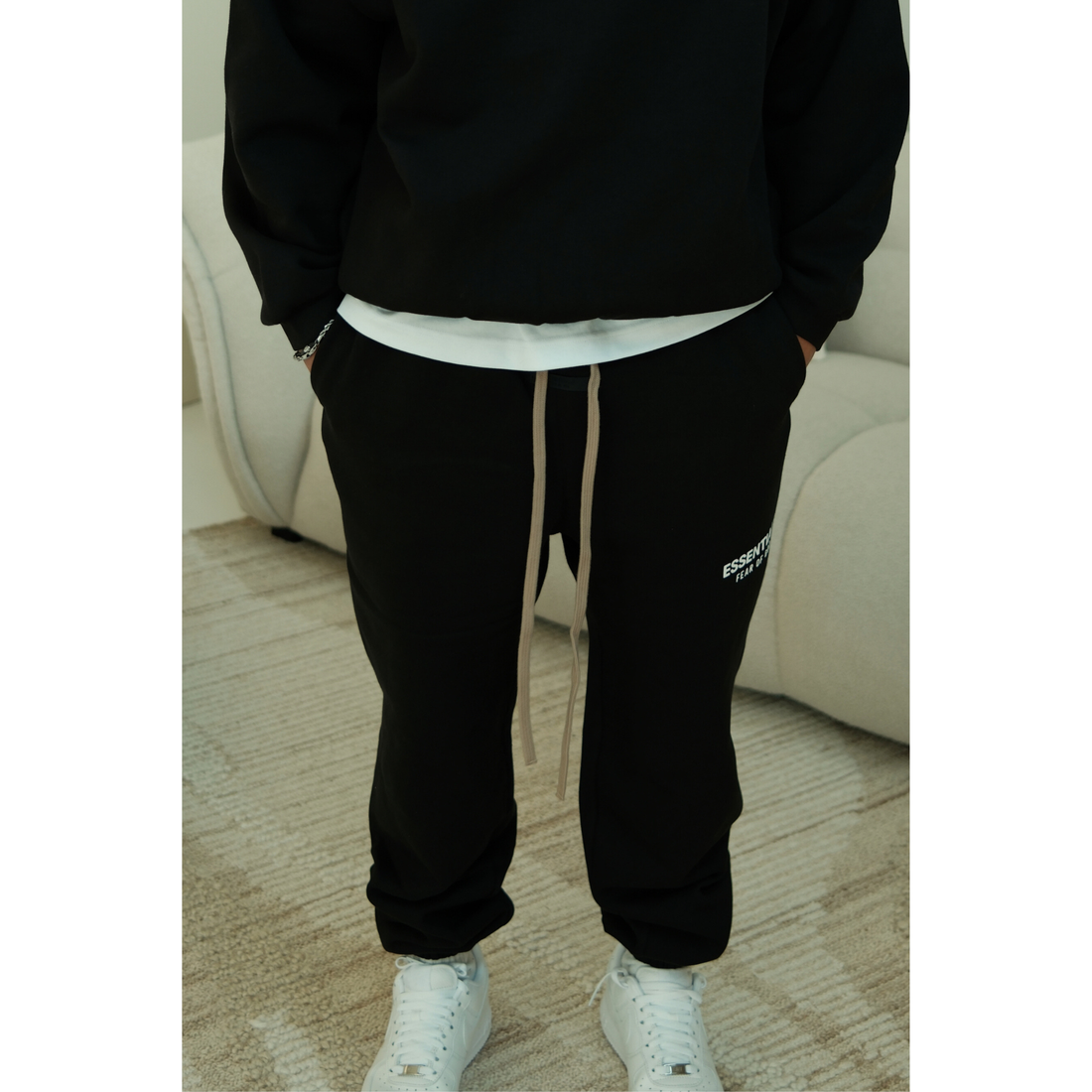 Fear of God Essentials FW24 Fleece sweatpants in black front view