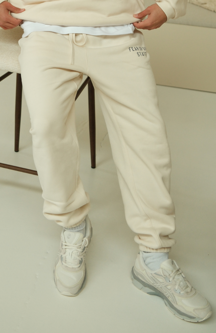 Fear of God ESSENTIALS sweatpants in fleece shell worn by model detail view