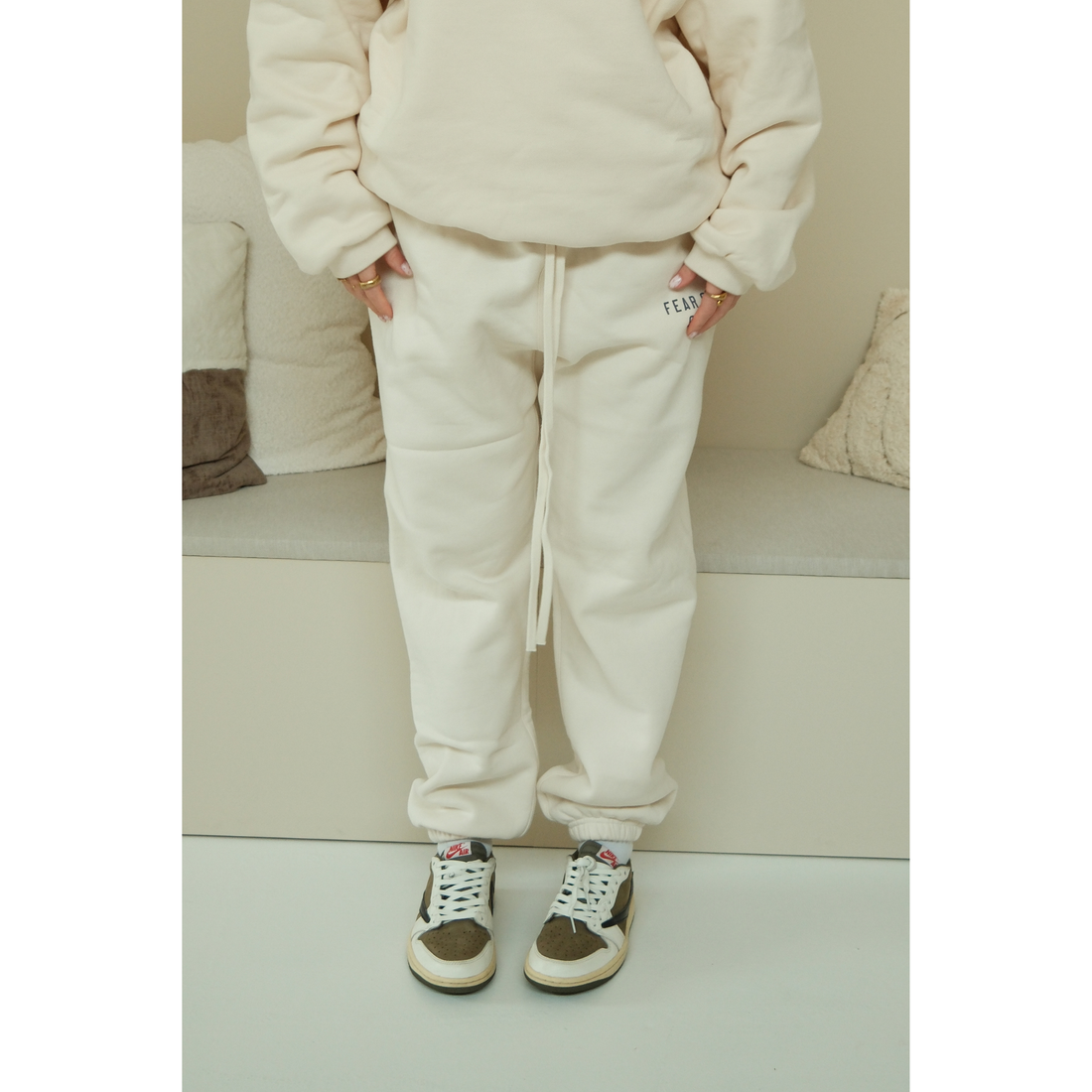 Fear of God Essentials sweatpants in shell front view