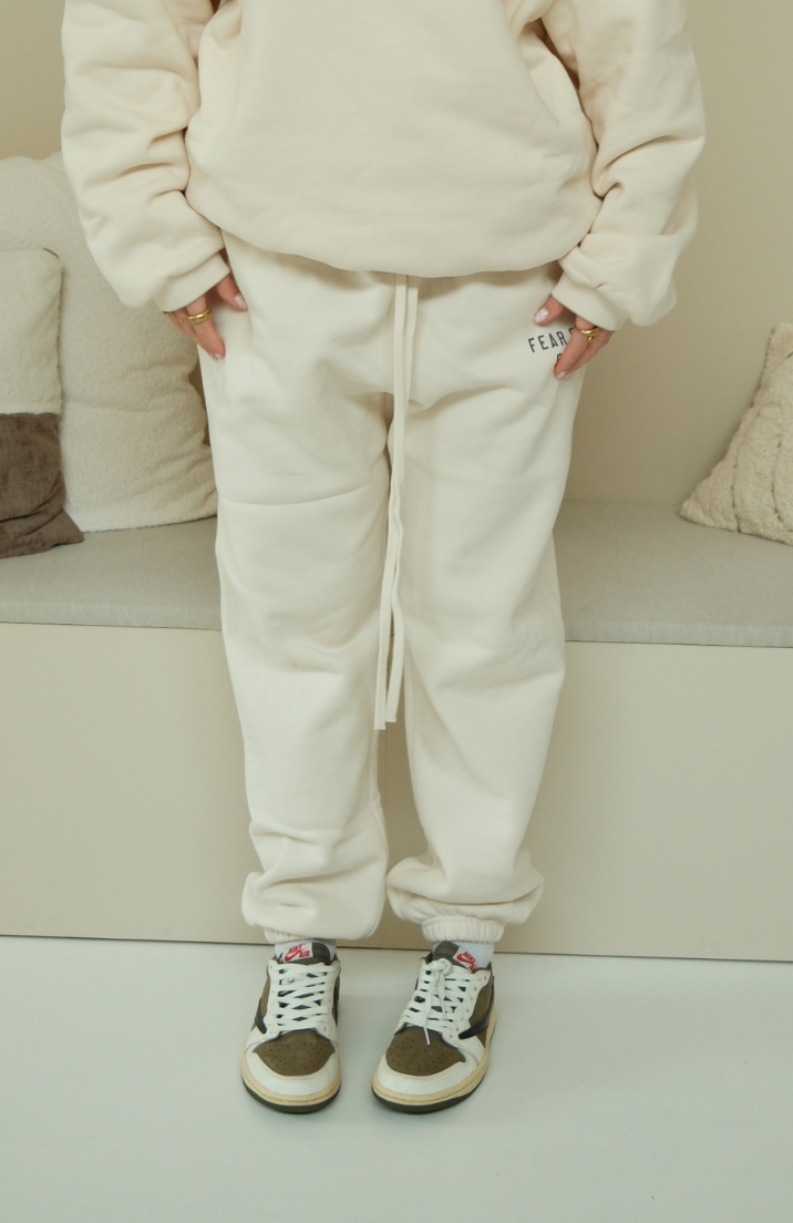 Fear of God ESSENTIALS sweatpants in fleece shell worn by model