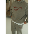 Fear of God Essentials FW24 hoodie and sweatpants set in dark heather close-up view