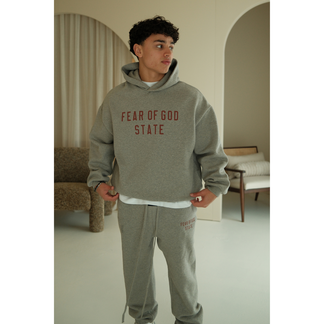Fear of God Essentials FW24 hoodie in dark heather front view