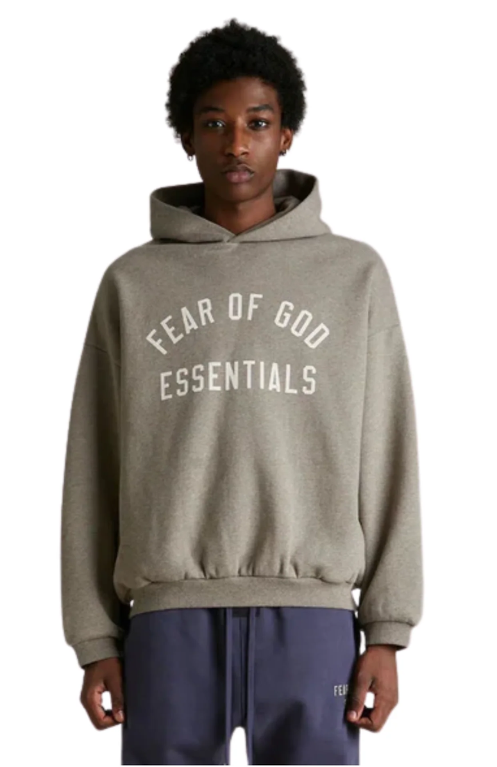 Fear of God Essentials FW24 Fleece hoodie in heather grey worn by model
