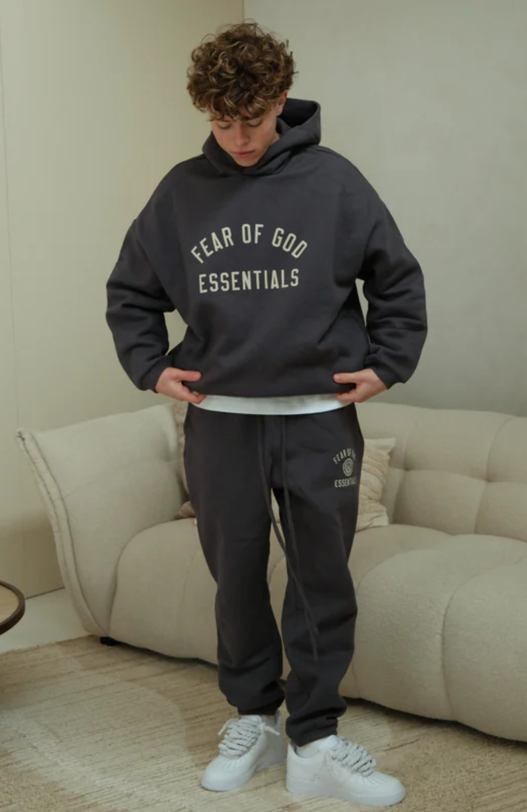 Fear of God ESSENTIALS hoodie and sweatpants set in fleece marine worn by model alternate view