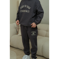Fear of God Essentials FW24 hoodie and sweatpants set in marine detail on model