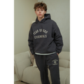 Fear of God Essentials FW24 hoodie and sweatpants set in marine on model front view