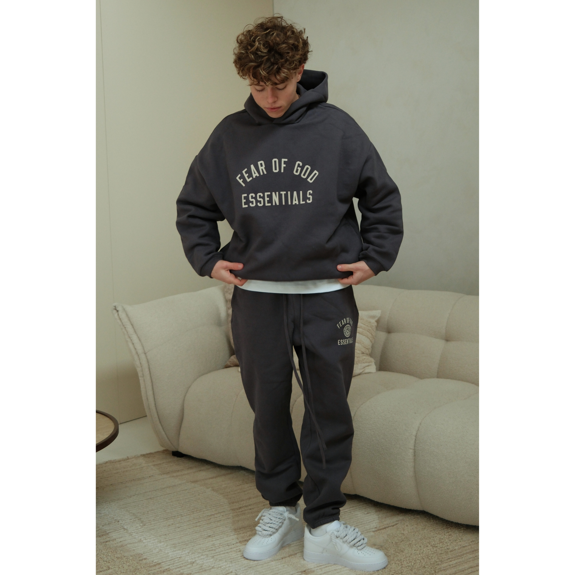 Fear of God Essentials FW24 hoodie and sweatpants set in marine on model