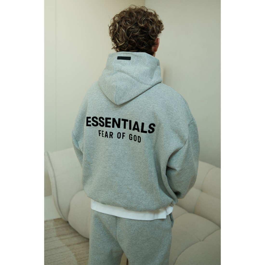 Fear of God Essentials FW24 hoodie in light heather front view