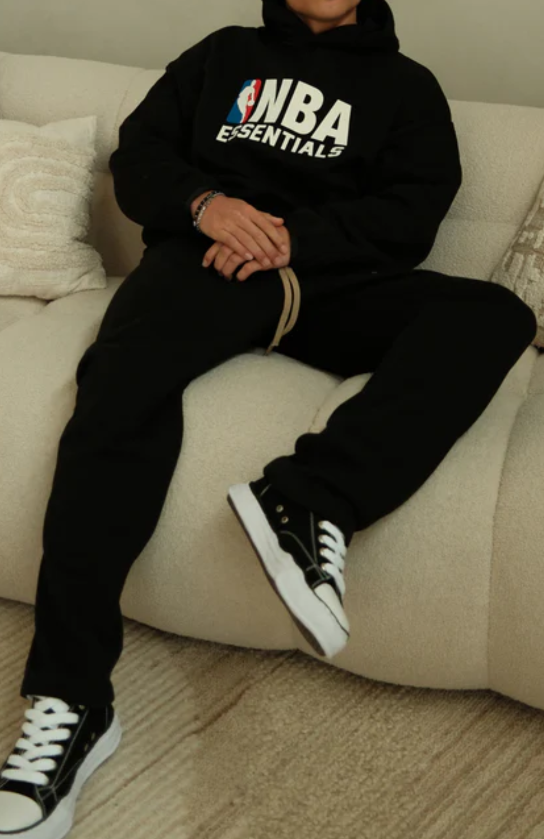 Fear Of God Essentials NBA Black Full Set sweatpants in black worn by model