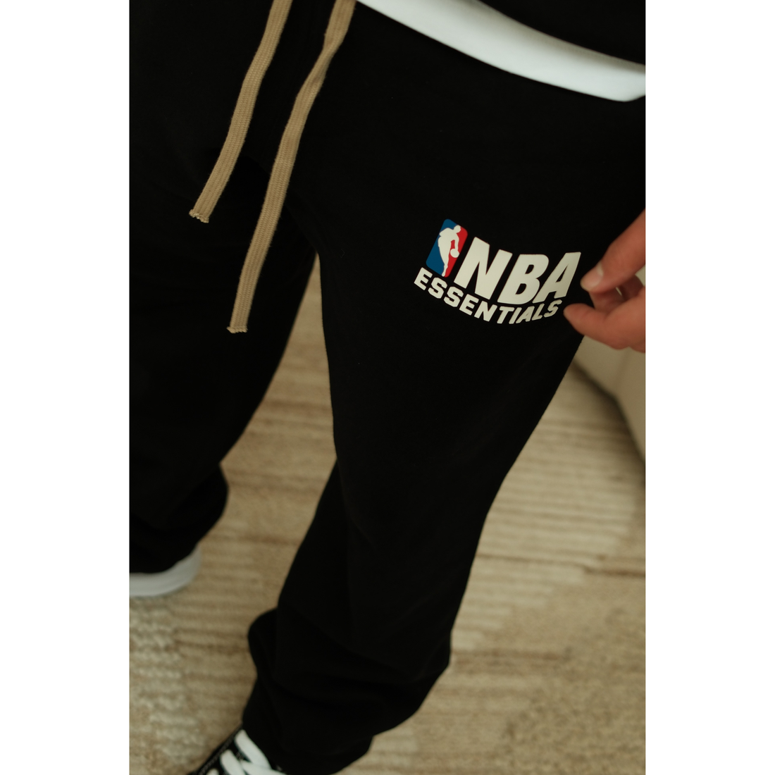 Fear of God Essentials NBA sweatpants in black front view