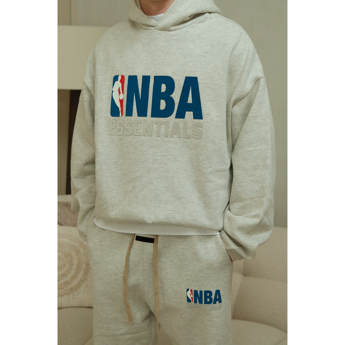 Fear of God Essentials NBA Light Heather hoodie in light heather front view