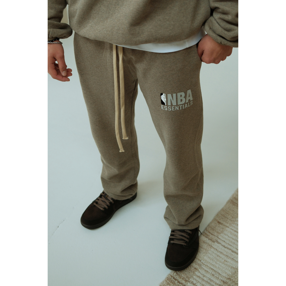 Fear of God Essentials NBA Warm Heather sweatpants in warm heather front view