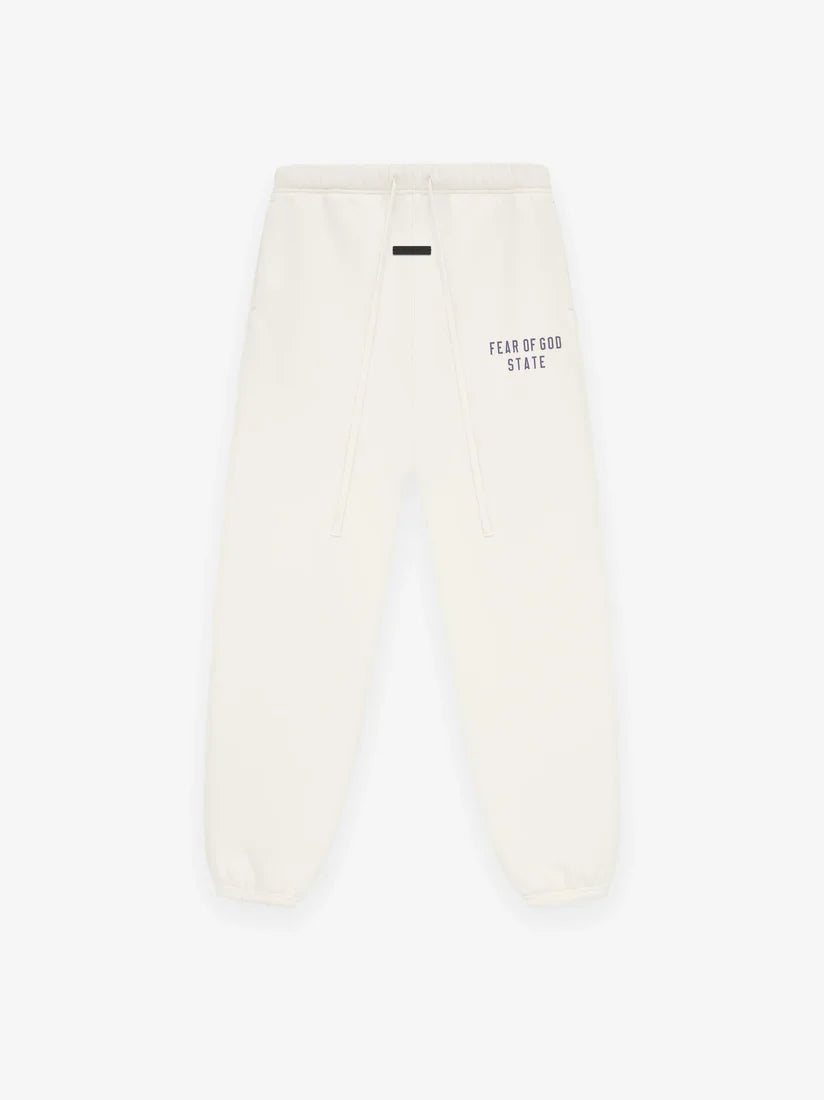 Fear of God Essentials Shell sweatpants in cream front view