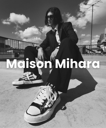 Maison Mihara sneakers worn by model in black and white